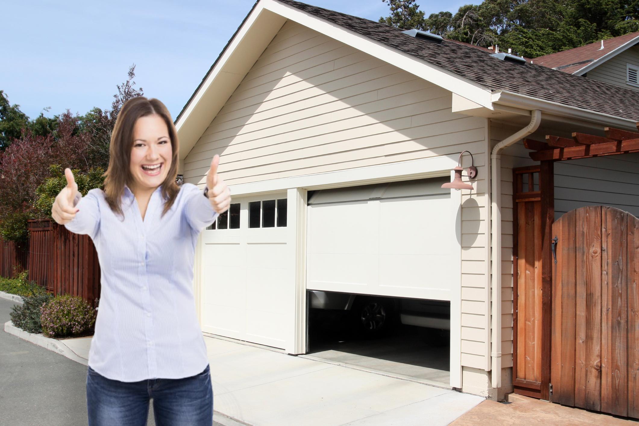 Happy woman after installing SnirtStopper Garage Door Seals